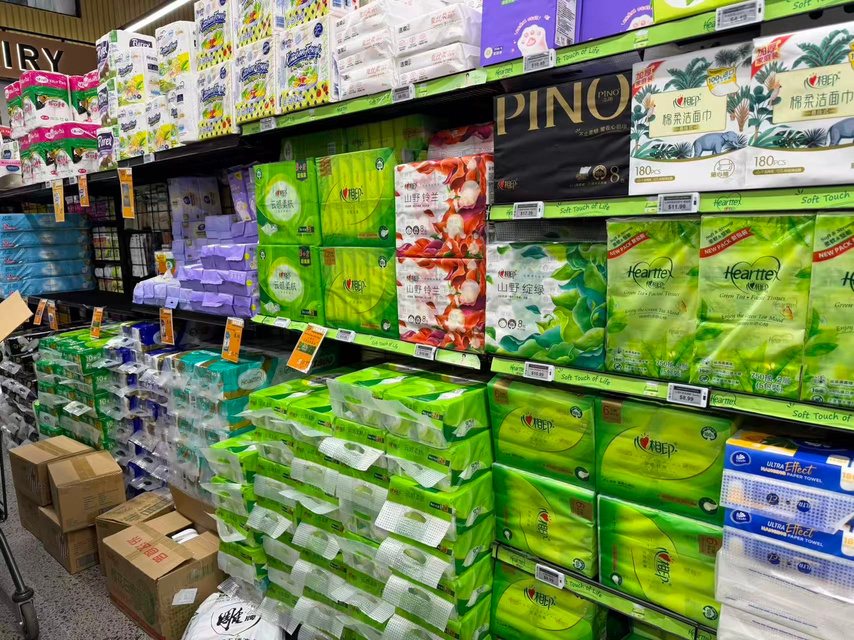 Supermarket shelves stocked with Hearttex tissue and PINO facial tissue